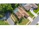 Beautiful aerial view of home featuring screened pool, lush landscaping and a large, neatly maintained yard at 1034 Featherstone Cir, Ocoee, FL 34761