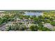 An elevated angle of the neighborhood with a large lake in the background at 1034 Featherstone Cir, Ocoee, FL 34761