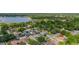 A high angle of the neighborhood with a large lake in the background at 1034 Featherstone Cir, Ocoee, FL 34761
