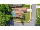 Stunning aerial view of this home featuring a screened-in pool and a well-maintained lawn at 1034 Featherstone Cir, Ocoee, FL 34761