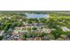 An elevated angle of the neighborhood with a large lake in the background at 1034 Featherstone Cir, Ocoee, FL 34761