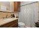 Bathroom with granite vanity, decorative backsplash, and shower-tub combination at 1034 Featherstone Cir, Ocoee, FL 34761