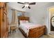 Cozy bedroom featuring a ceiling fan, natural light and carpet flooring at 1034 Featherstone Cir, Ocoee, FL 34761