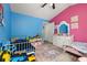 bedroom with bright colors and white furniture at 1034 Featherstone Cir, Ocoee, FL 34761