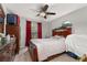 Bedroom with hardwood furniture, carpet, and natural light from the window at 1034 Featherstone Cir, Ocoee, FL 34761