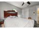 Bedroom with hardwood furniture, carpet, and natural light from the window at 1034 Featherstone Cir, Ocoee, FL 34761