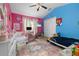 bedroom with bright colors and white furniture at 1034 Featherstone Cir, Ocoee, FL 34761