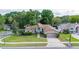 Inviting single-Gathering home with a lush front lawn, mature trees, and well-maintained exterior at 1034 Featherstone Cir, Ocoee, FL 34761