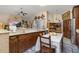 Well-lit kitchen with ample counter space, and matching cabinetry and flooring at 1034 Featherstone Cir, Ocoee, FL 34761