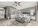 Spacious main bedroom featuring elegant decor, plush carpeting and walk-in closet at 1034 Featherstone Cir, Ocoee, FL 34761