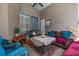 Comfortable covered patio with multiple seating options for relaxing or entertaining at 1034 Featherstone Cir, Ocoee, FL 34761