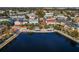 Beautiful lakefront community with colorful buildings, lush landscaping, and a serene waterfront ambiance at 109 Grinnell Pl, Celebration, FL 34747