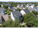 An aerial view showcases a residential neighborhood with neatly arranged homes and mature trees at 109 Grinnell Pl, Celebration, FL 34747
