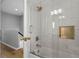 Bathroom featuring shower with glass door, modern fixtures, and tile surround at 109 Grinnell Pl, Celebration, FL 34747
