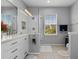 Bathroom featuring a large vanity, mirror and glass door shower at 109 Grinnell Pl, Celebration, FL 34747
