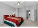 Bedroom with neutral walls, ceiling fan and access to ensuite bathroom at 109 Grinnell Pl, Celebration, FL 34747