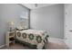Neutral toned bedroom with a window at 109 Grinnell Pl, Celebration, FL 34747