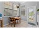 Cozy dining area with tile floors, natural light, and a view to the backyard at 109 Grinnell Pl, Celebration, FL 34747
