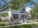Charming two-story home with a picket fence, well-kept lawn, and beautiful landscaping in a sunny setting at 109 Grinnell Pl, Celebration, FL 34747