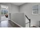 Upstairs hallway with wood floors and view into the bedroom at 109 Grinnell Pl, Celebration, FL 34747