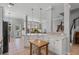 Open-concept kitchen with island, stainless steel appliances, and abundant natural light at 109 Grinnell Pl, Celebration, FL 34747