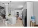 Spacious kitchen with stainless steel appliances, white cabinetry, and eat-in breakfast bar at 109 Grinnell Pl, Celebration, FL 34747