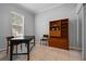 Versatile office space with tile floors, natural light, and built-in shelving at 109 Grinnell Pl, Celebration, FL 34747