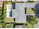 Beautiful home with a pristine pool, lush lawn, and a modern-looking driveway and walkway at 113 Tangelo Ct, Maitland, FL 32751