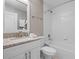Bathroom features a white vanity with granite countertop and a tub shower with subway tile at 113 Tangelo Ct, Maitland, FL 32751