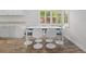Bright dining area with shuttered windows, modern furniture, and a cozy atmosphere at 113 Tangelo Ct, Maitland, FL 32751