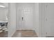 Inviting foyer featuring neutral tones, a bright white door, and access to multiple rooms at 113 Tangelo Ct, Maitland, FL 32751