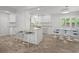 Spacious kitchen with an island, bar seating, and an adjacent dining area at 113 Tangelo Ct, Maitland, FL 32751