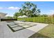 Backyard featuring a pool with stone border and in-ground square planters at 113 Tangelo Ct, Maitland, FL 32751