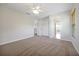 Bedroom featuring neutral carpet, ceiling fan and paint, and an open doorway to other rooms at 14522 Old Thicket Trace, Winter Garden, FL 34787