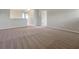 Spacious bonus room with neutral walls and plush carpeting, ready for any living style at 14522 Old Thicket Trace, Winter Garden, FL 34787