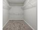 Walk-in closet with plenty of shelving for optimal storage and organization at 14522 Old Thicket Trace, Winter Garden, FL 34787
