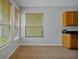 Bright dining area with tile floors, view of the yard and lots of natural light at 14522 Old Thicket Trace, Winter Garden, FL 34787
