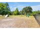 Community dog park with green grass, chain link fence, and play equipment at 14522 Old Thicket Trace, Winter Garden, FL 34787