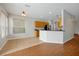 View of the kitchen and adjacent dining area with stainless steel appliances at 14522 Old Thicket Trace, Winter Garden, FL 34787