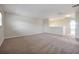 Open loft area with neutral walls and carpet with a great view at 14522 Old Thicket Trace, Winter Garden, FL 34787