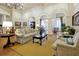 Elegant clubhouse living room featuring comfortable seating, tasteful decor, and ample natural light at 14522 Old Thicket Trace, Winter Garden, FL 34787