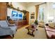 Elegant living room featuring custom built-ins, and large windows providing plenty of natural light at 14522 Old Thicket Trace, Winter Garden, FL 34787