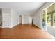 Spacious living room with wood floors, an open layout, and sliding door access to the outdoor patio at 14522 Old Thicket Trace, Winter Garden, FL 34787