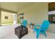 A covered patio with inviting seating and a decorative fire pit, perfect for relaxing at 14522 Old Thicket Trace, Winter Garden, FL 34787