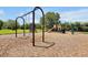 Community playground featuring swings, slides, and a wood chip ground for safe play at 14522 Old Thicket Trace, Winter Garden, FL 34787