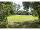 The home features a spacious back yard with a covered patio at 1512 Southwind Ct, Casselberry, FL 32707
