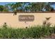 Eagle's Nest community sign with decorative landscaping, brick accents, and American flag at 1512 Southwind Ct, Casselberry, FL 32707