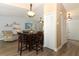 Inviting dining area seamlessly connecting to the living space, enhanced by wood-look floors at 1512 Southwind Ct, Casselberry, FL 32707