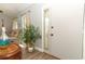 Welcoming entryway with neutral walls, wood-look tile flooring, and a view into the adjacent living space at 1512 Southwind Ct, Casselberry, FL 32707