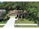 Charming single-story home with a well-manicured front yard and a two-car garage at 1512 Southwind Ct, Casselberry, FL 32707
